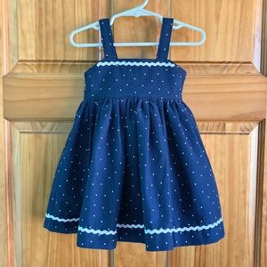 Girl’s size 2 handmade navy blue and white polka dotted jumper with ric-rac trim